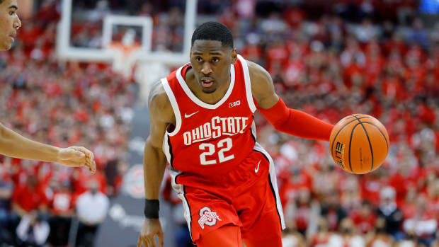 Ohio State Buckeyes guard Malaki Branham (22) dribbles past Michigan Wolverines forward Caleb Houstan (22) during the second half at Value City Arena.